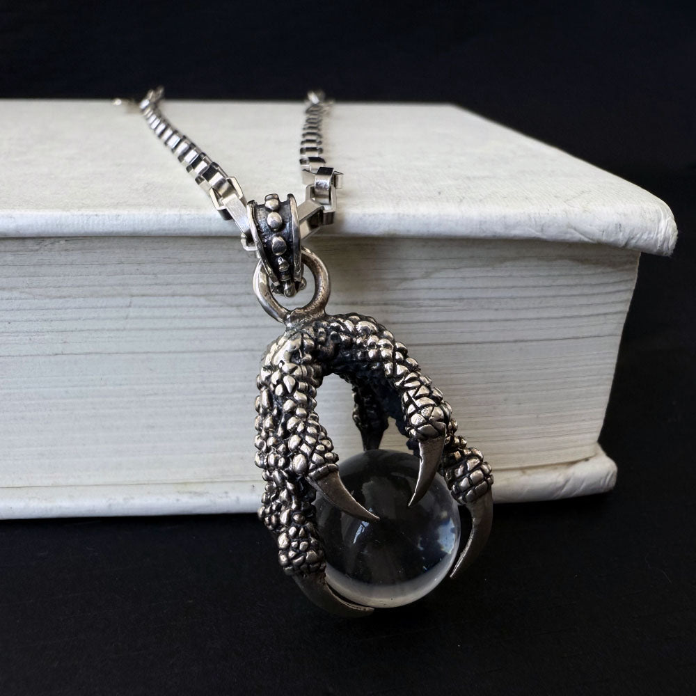 The Eagle‘s Claw Grabs the Crystal Ball Pendant Necklace