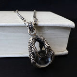 The Eagle‘s Claw Grabs the Crystal Ball Pendant Necklace
