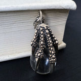 The Eagle‘s Claw Grabs the Crystal Ball Pendant Necklace